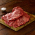 two british wagyu bavette steaks on a wooden board