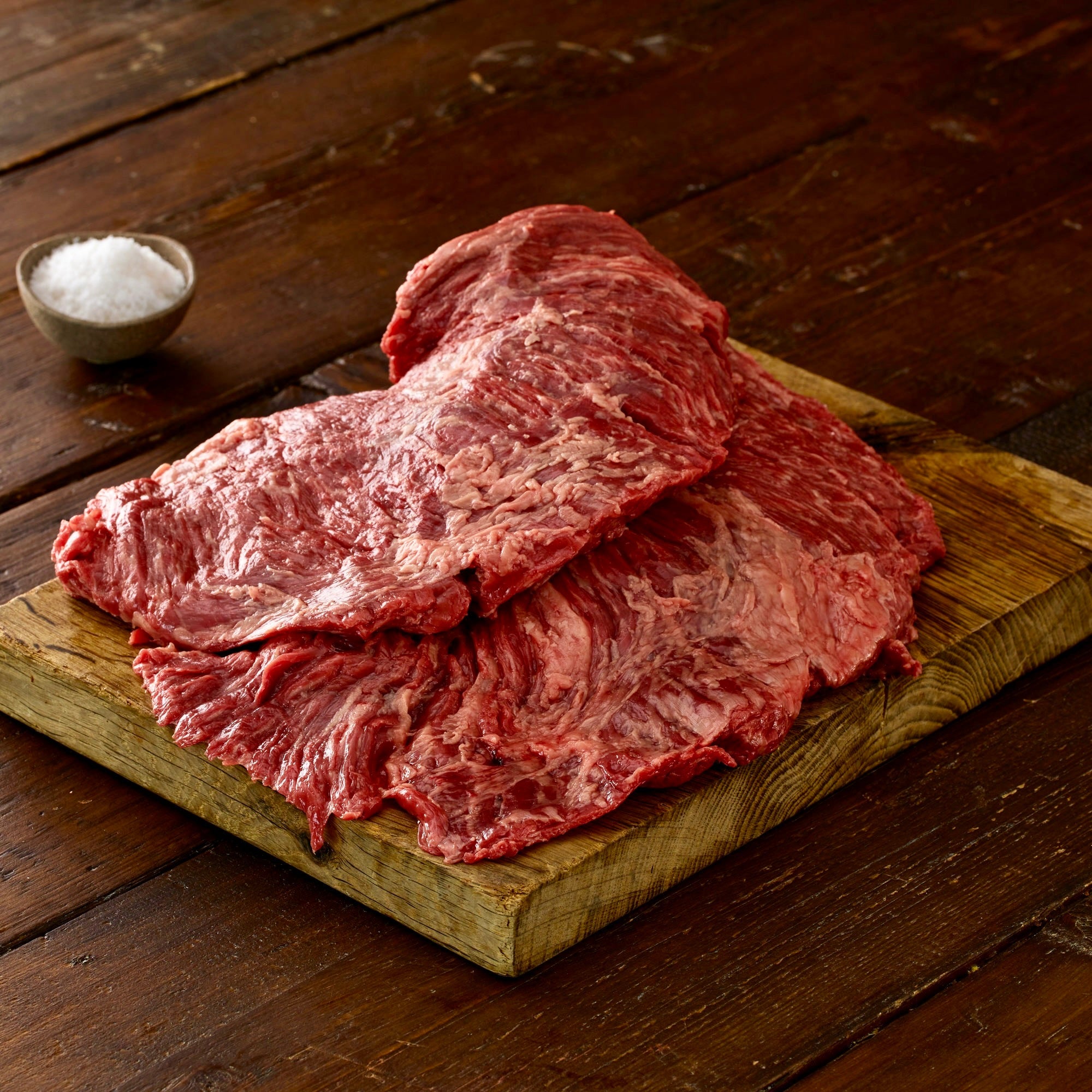 two british wagyu bavette  steaks on a wooden board